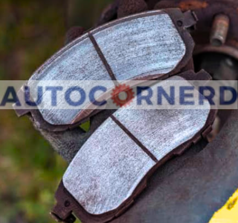 Two brake pads with shiny friction surfaces.