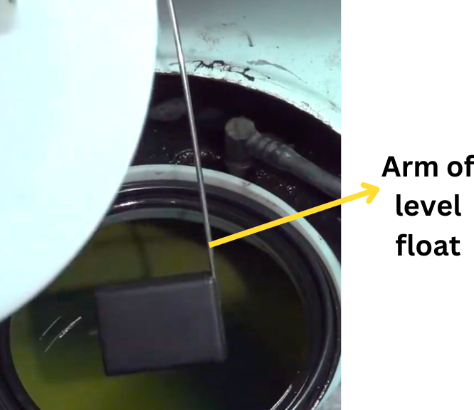 Fuel-level sender float and arm identified beside a pump assembly.