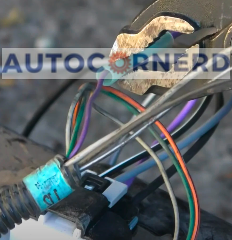 Fuel-pump harness connector with its colored wiring exposed.
