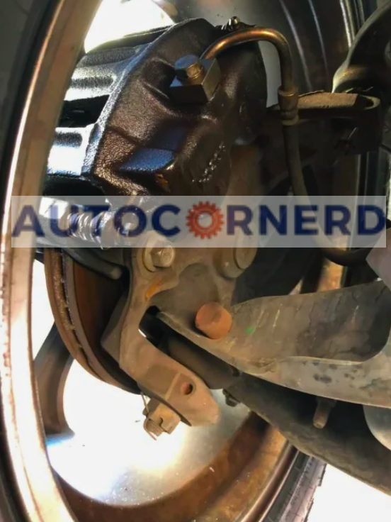 Fluid residue around the inside of a wheel and brake assembly.
