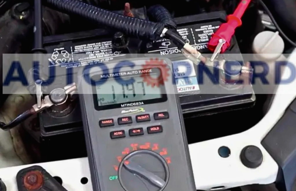 Multimeter connected to battery terminals to measure voltage.