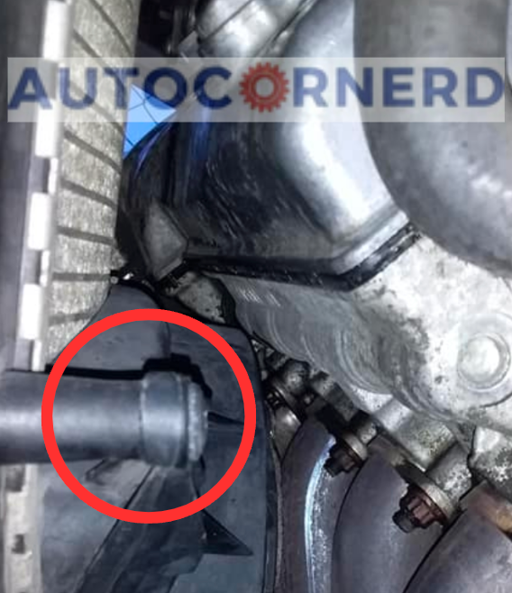 Radiator drain-fitting area identified by a red circle.