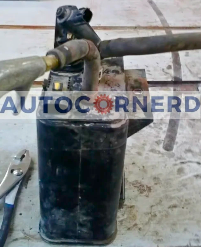 Removed charcoal canister and its attached vapor-line fittings.