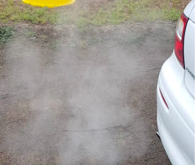 thin white smoke from car due to condensation
