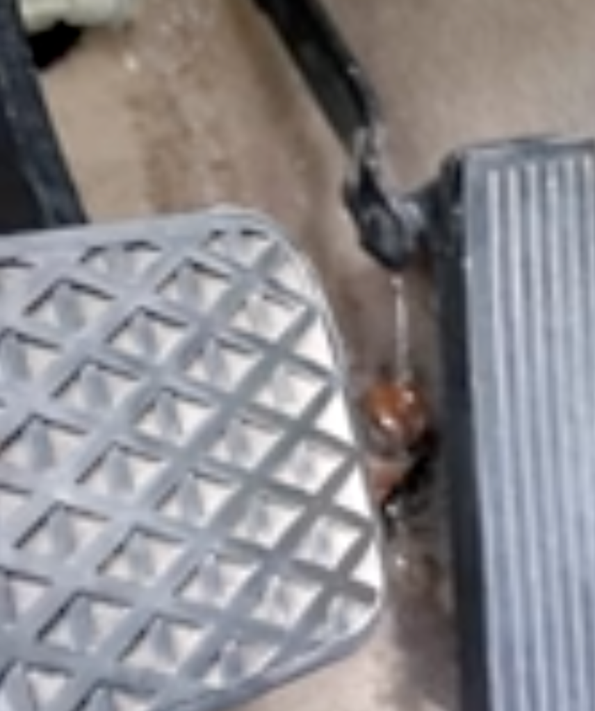 water dripping from under steering wheel