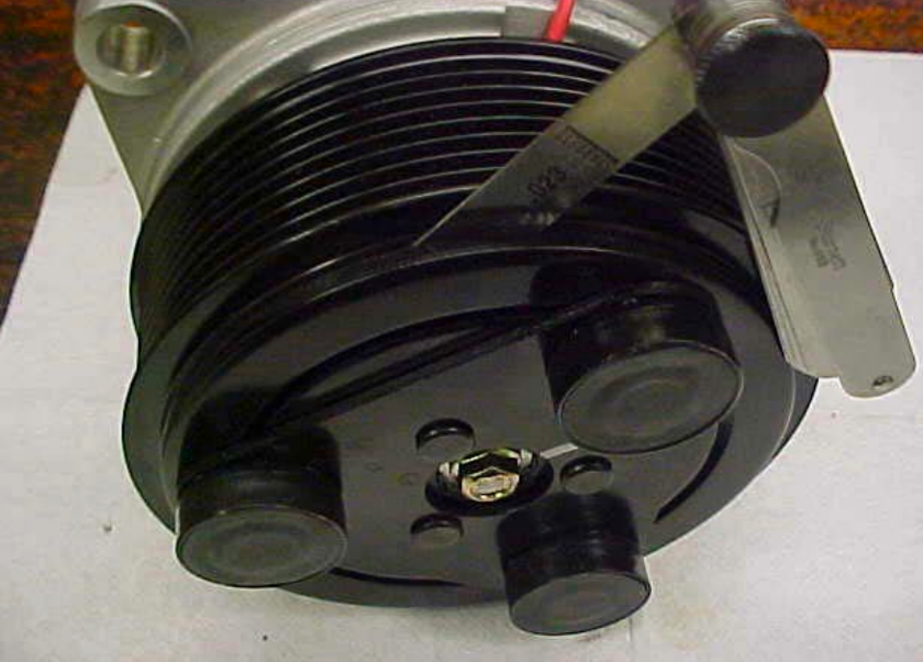 using feeler gauge to determine air gap between friction plate of clutch and ac compressor pulley