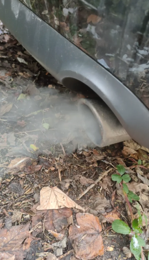 grey smoke from exhaust with fuel smell