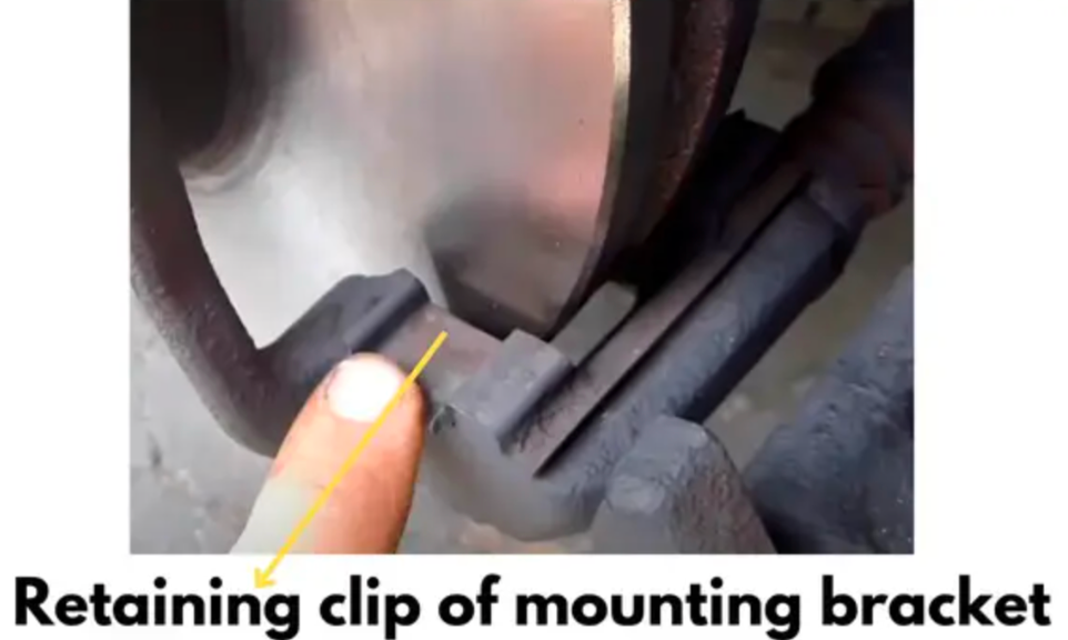 retaining clips of caliper bracket need to be lubricated