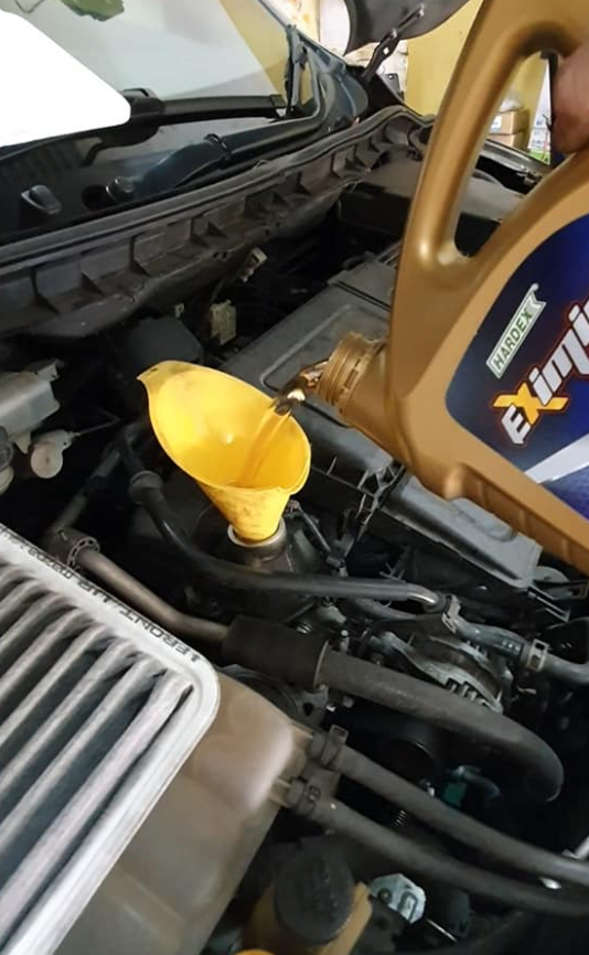 adding engine oil in car 