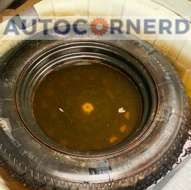 puddle of water in a spare tire well also causes fart-like smell in car