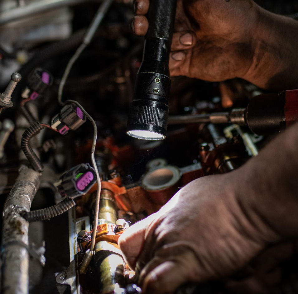 Asjad Emir, founder of Autocornerd, is learning how to inspect harness connectors of different engine sensors and other electronic components.