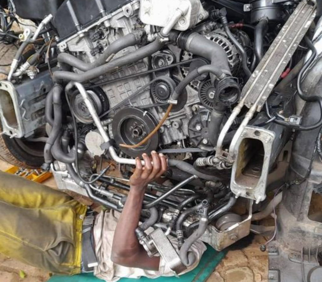 Asjad Emir, founder of autocornerd, is learning complete engine overhauling process which includes inspection of different engine components like serpentine belt, engine mounts, transmission etc.